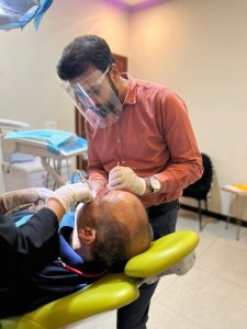 Dr Aamir Rafiq during dental treatment
